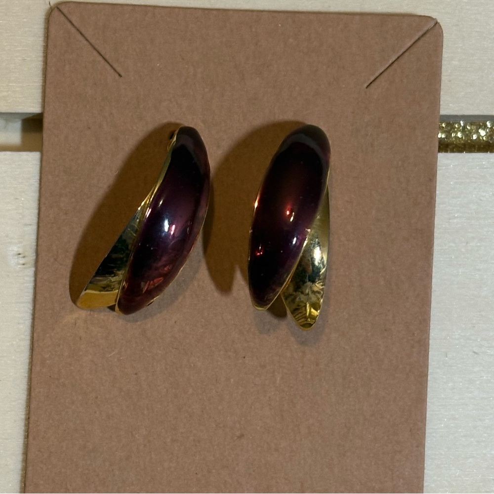 Beautiful gold tone and burgundy colored earrings.